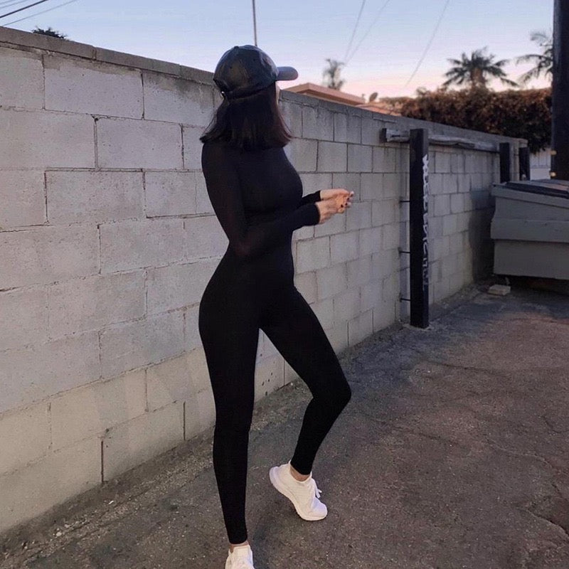 Form-fitting black jumpsuit.