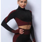 A three-piece athletic set consisting of a sports bra, leggings, and a zip-up jacket.