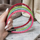 Glittery beaded slim headband.