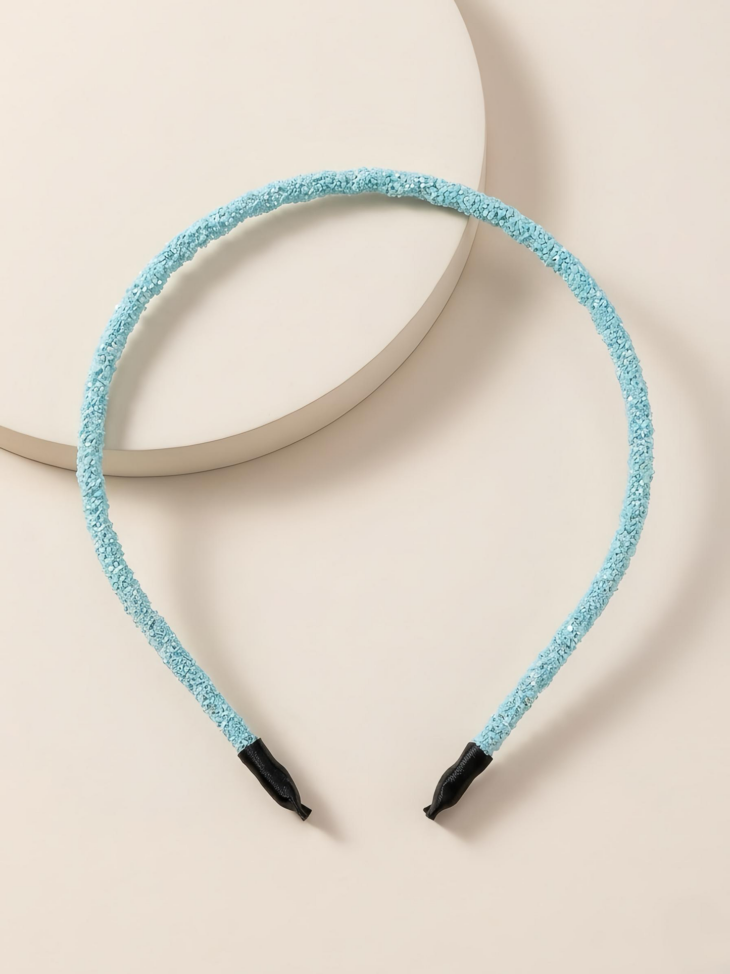 Glittery beaded slim headband.