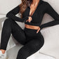 A three-piece athletic set consisting of a sports bra, leggings, and a zip-up jacket.