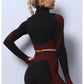 A three-piece athletic set consisting of a sports bra, leggings, and a zip-up jacket.