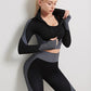 A three-piece athletic set consisting of a sports bra, leggings, and a zip-up jacket.
