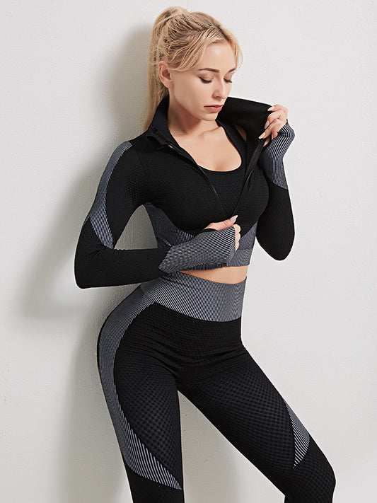 A three-piece athletic set consisting of a sports bra, leggings, and a zip-up jacket.