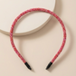 Glittery beaded slim headband.