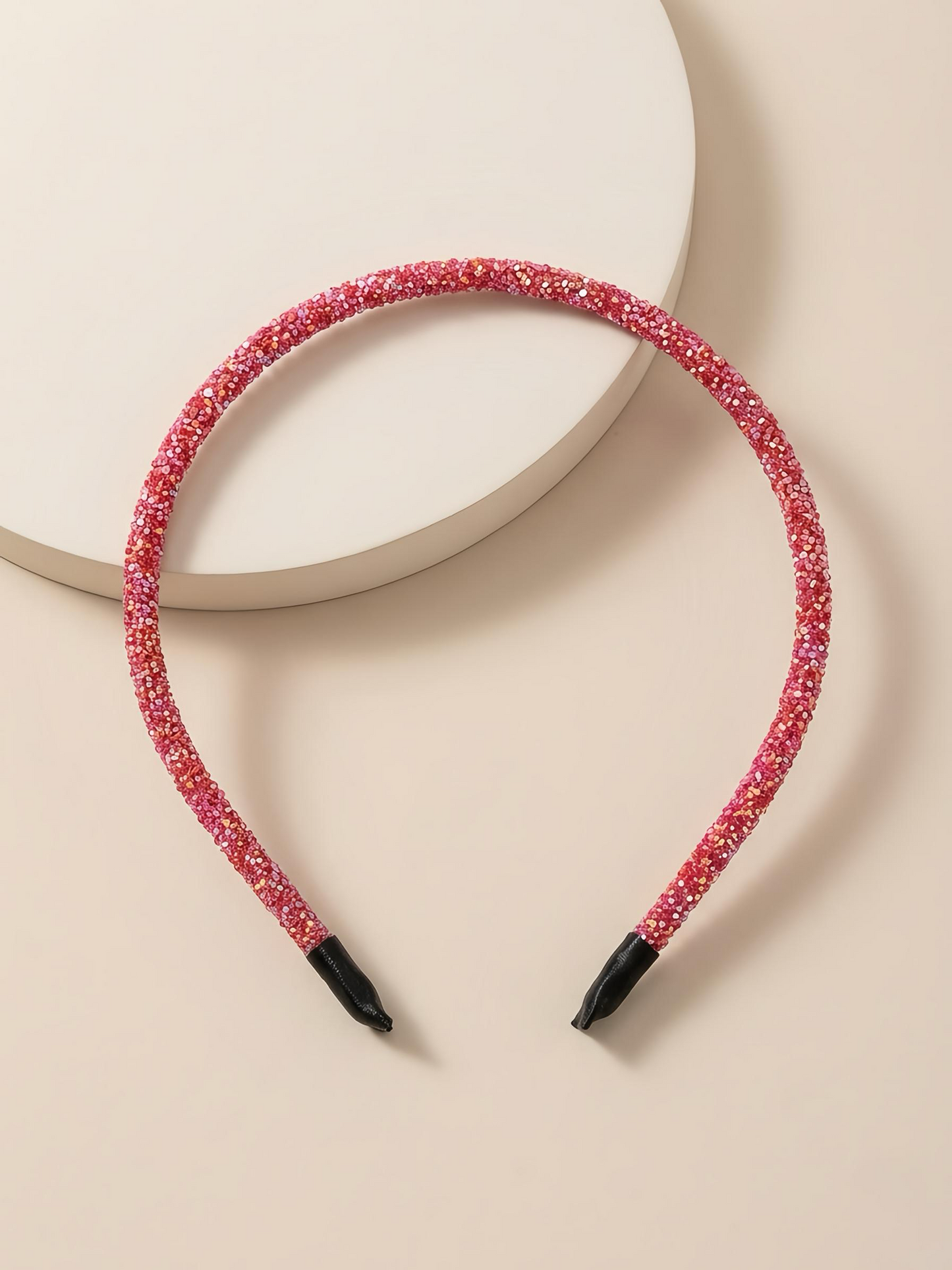 Glittery beaded slim headband.