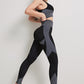 A three-piece athletic set consisting of a sports bra, leggings, and a zip-up jacket.
