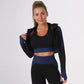 A three-piece athletic set consisting of a sports bra, leggings, and a zip-up jacket.