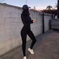 Form-fitting black jumpsuit.